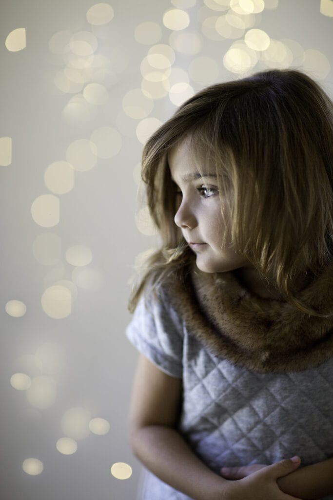 Girl in studio with twinkle lights