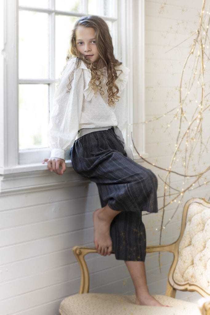 Elegant holiday photo Christmas girl in window