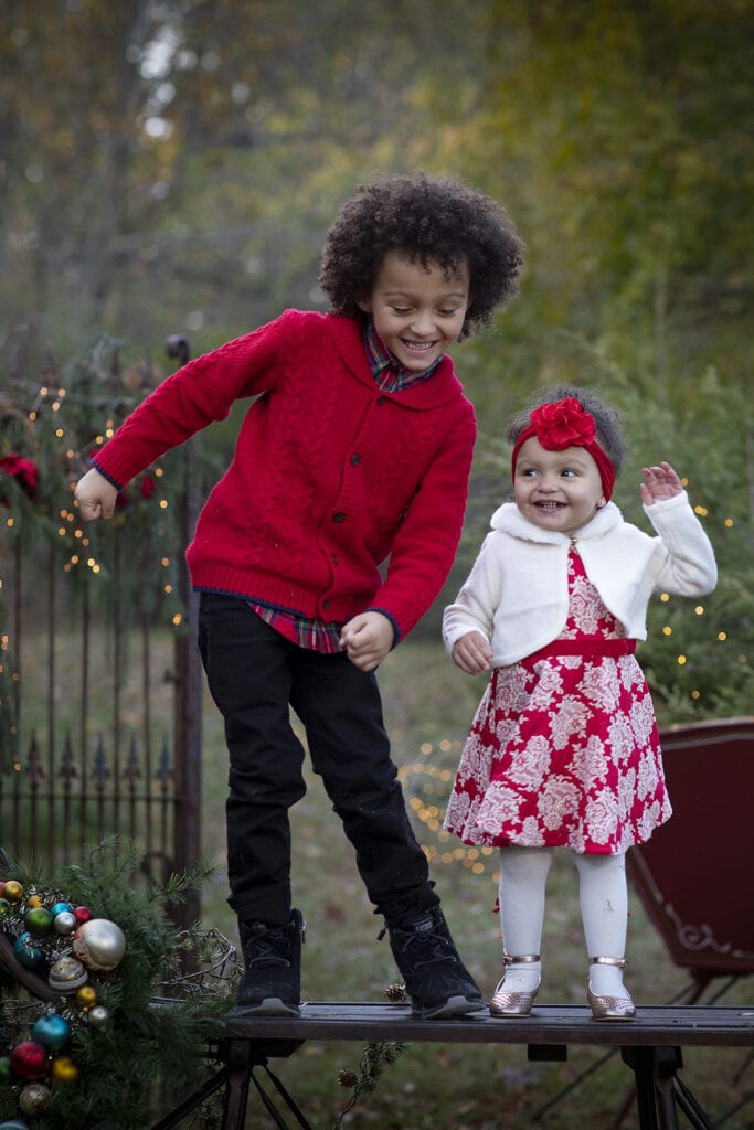 Brother and sister on Christmas  sleigh