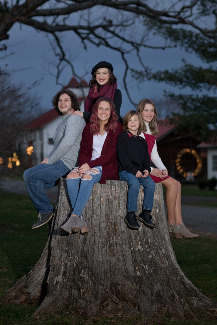 Family at dusk on 100 year old Oak tree