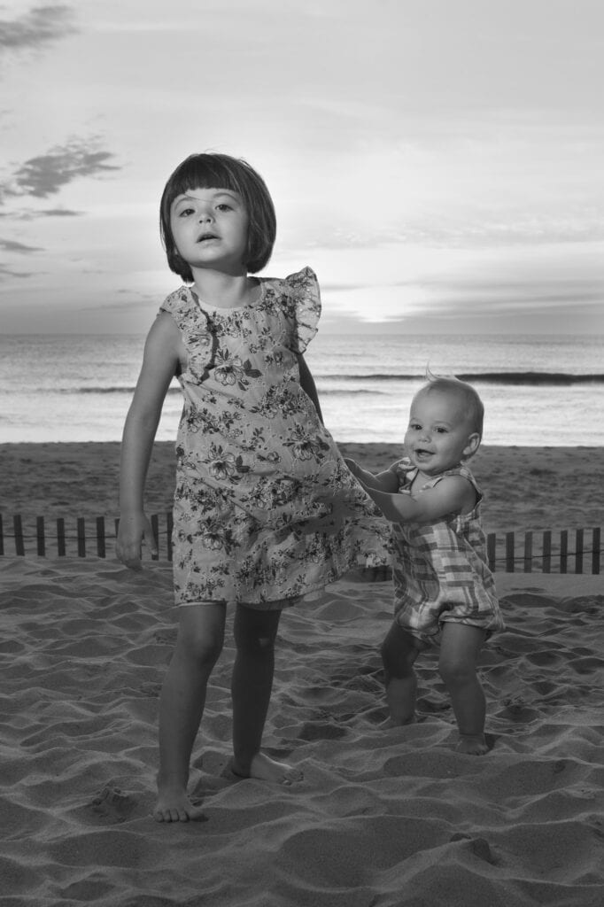 small girls on beach at sunrise