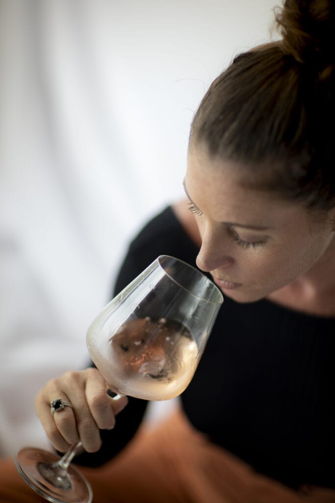 sommelier smelling rose wine