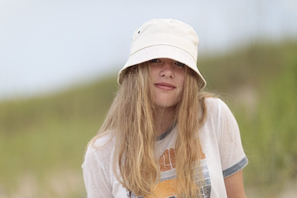 Vintage looking girl with hat on the beach in Duck, NC