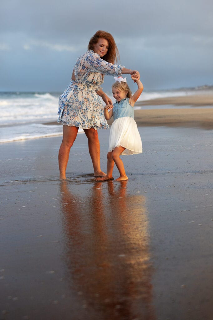 Mom ad daughter on beach