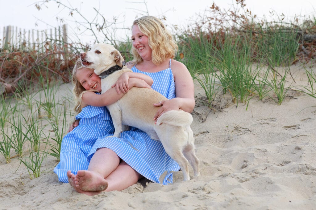 mother, daughter and dog on beach sanderling nc