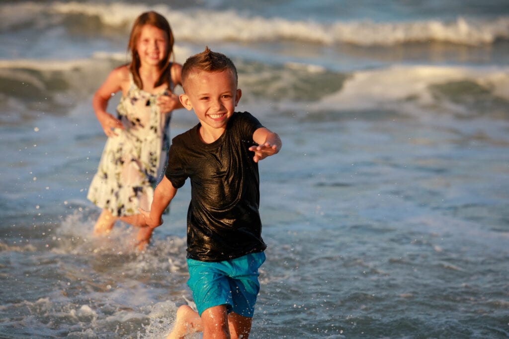 Boy running in the waves, Corolla NC