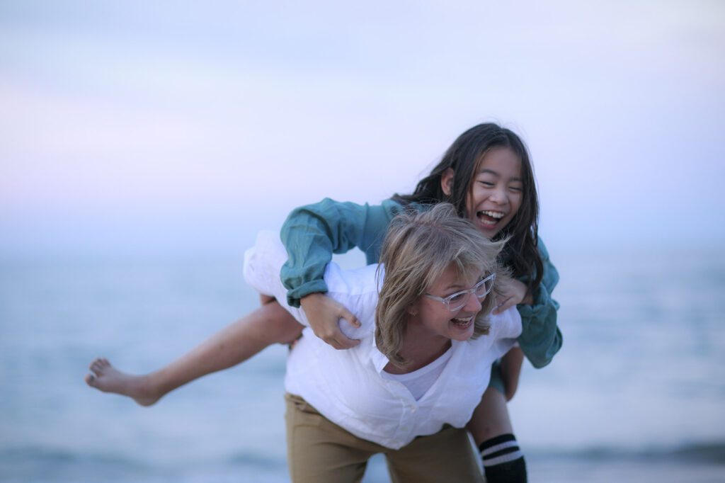 Mom and daughter playing in the beach