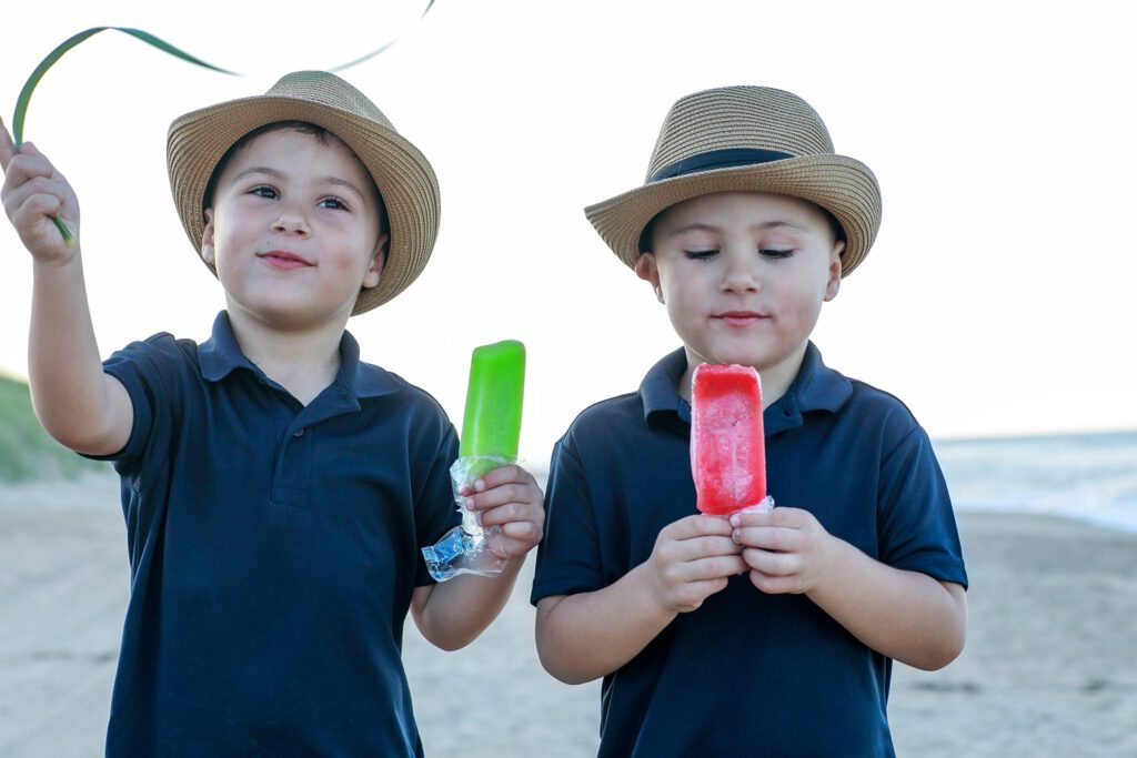 Twin boys on the beach with popsicles Duck, NC