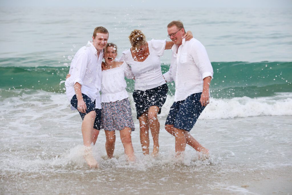 Family splashing in the Ocean in Duck NC