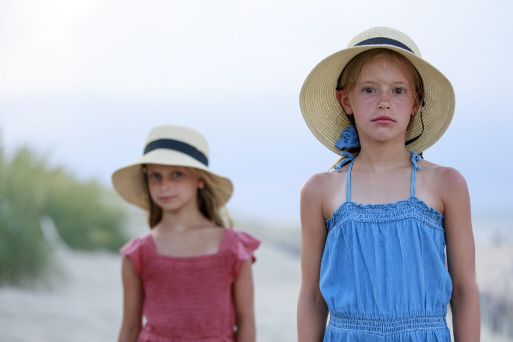Beach girls in hats, looking vintage Duck, NC