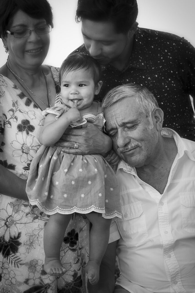 Black and white images of a grandfather with granddaughter on the beaches of the outer banks nc, town of duck nc, family portraits in Duck nc