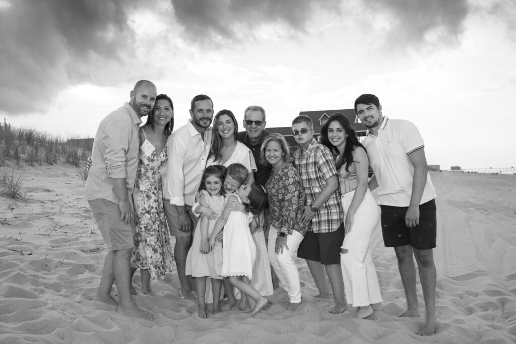 large family group on the beach in black and white in the outer banks