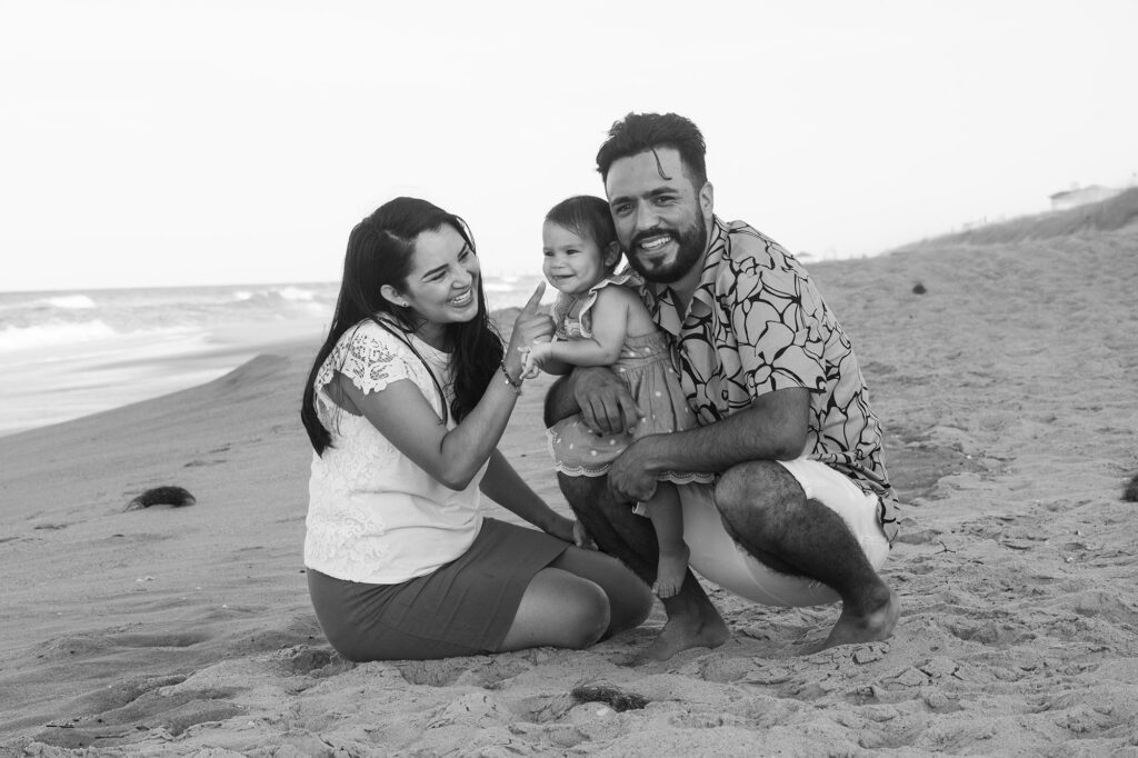 Young mom and dad enjoying beach time on the beaches of Duck NC, duck nc family photographer, duck nc family photographer