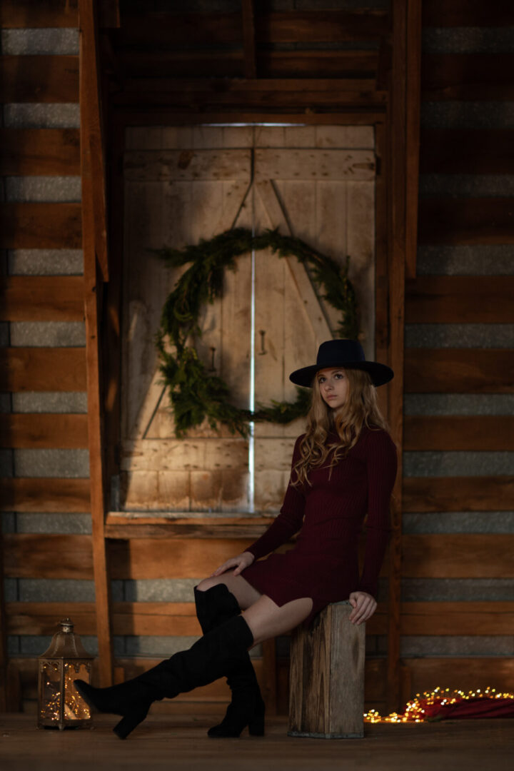 Stylized girl in old barn holiday setting in Waterford, Virginia