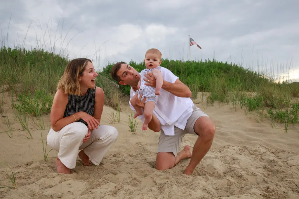 Mom and Dad with small baby on the beach