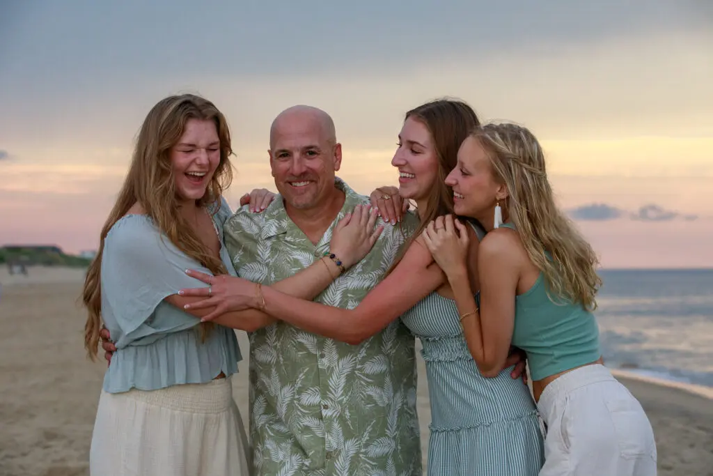 Dad on the beach in Nags Head with his beautiful daughters