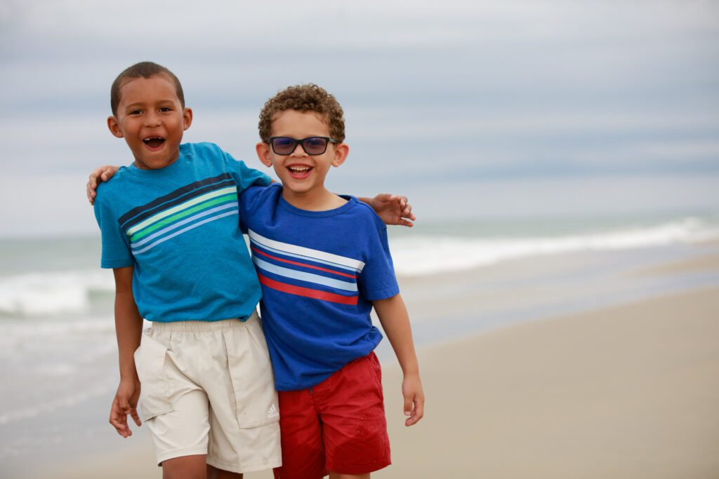 brothers enjoying an afternoon on the beach in Duck NC