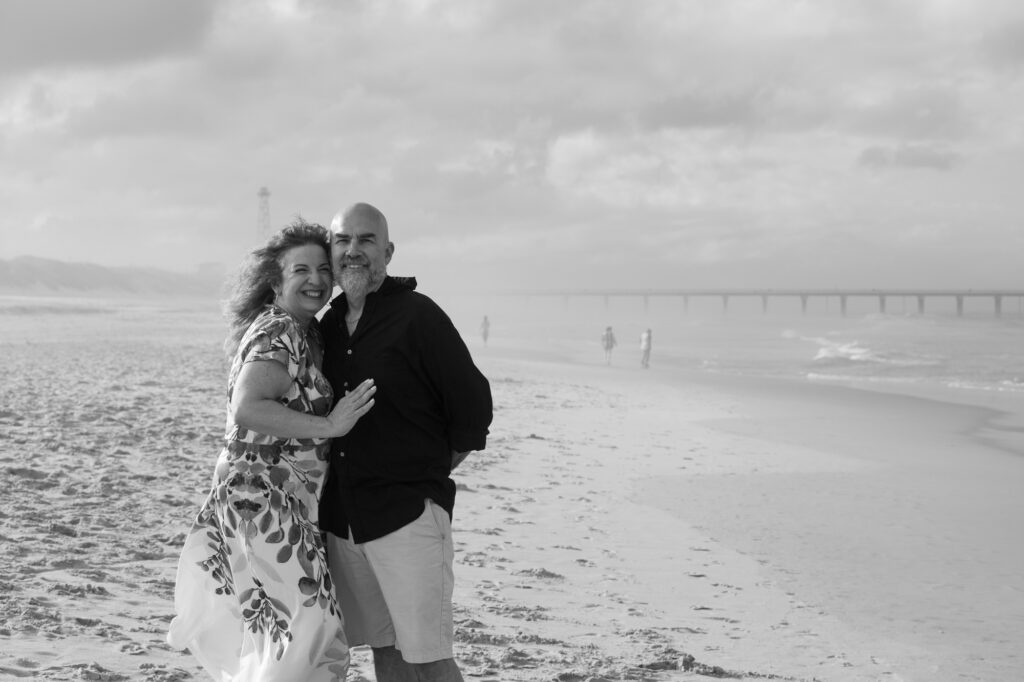 Black and white beach photo of couple married for 40 years on the beaches of Duck, NC