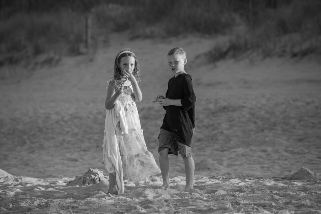 Brother and sister on the beach in Duck NC at golden hour