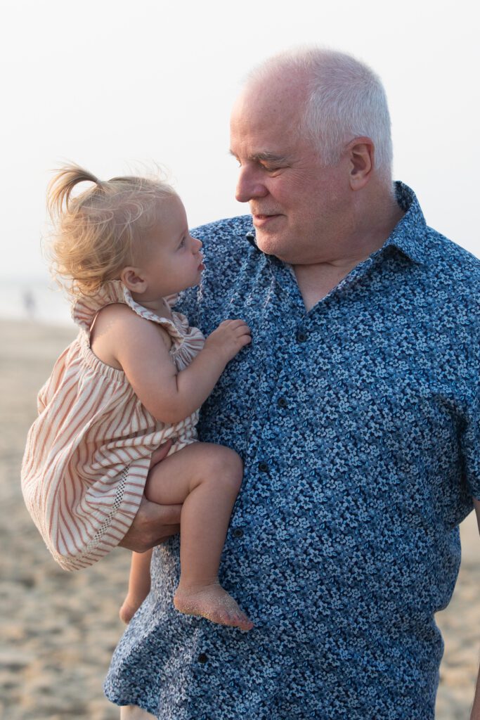 Grandfather being looked at inquisitively on the beach in Duck, NC